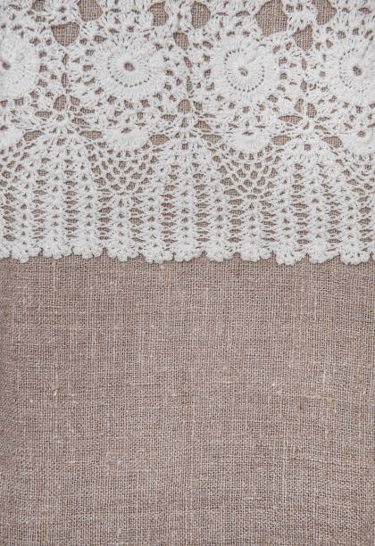 istock Vintage lace fabric border on the old burlap textile 869356238