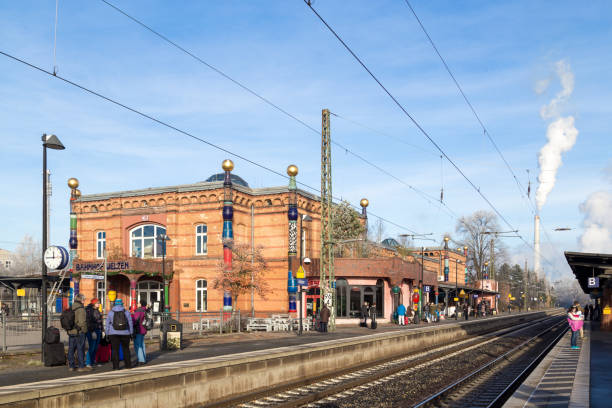 Uelzen, Germany - December 04, 2016: People waiting on the platform at the train station designed by Austrian artist Friedensreich Hundertwasser