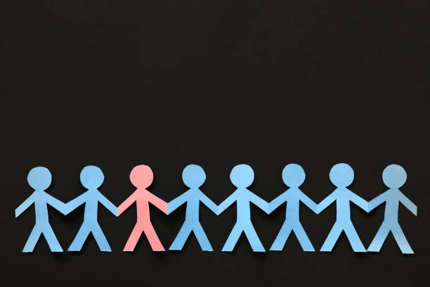 istock Paper people on the black paper background 869360172