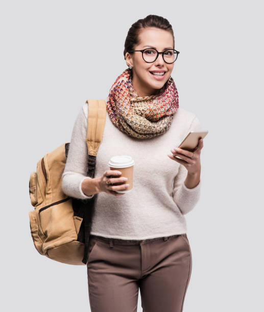 istock Happy young student girl using smart phone 869364390
