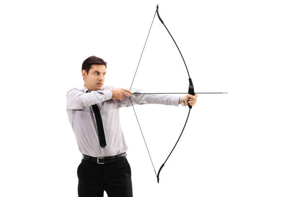 istock Businessman aiming with a bow and arrow 869368774