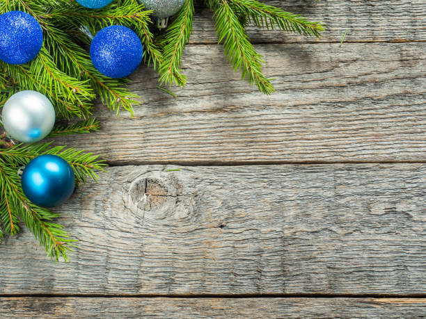 istock Christmas fir tree with decoration on a wooden board 869371538