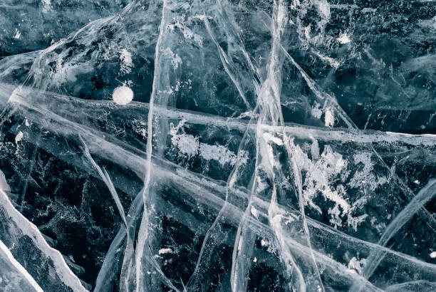 istock cracks on the ice surface of lake Baikal 869371840