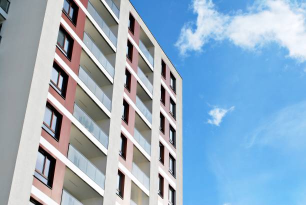 istock Modern, Luxury Apartment Building against blue sky 869372190