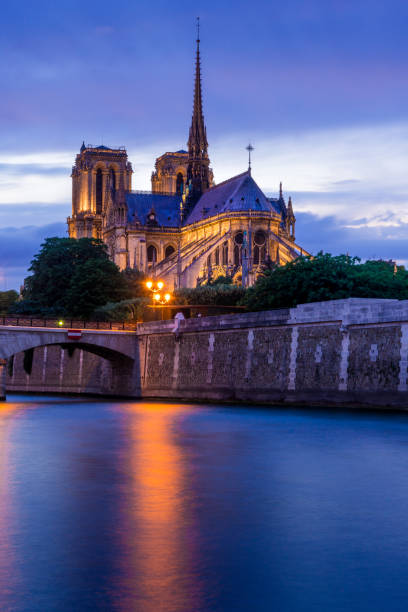 istock Blue purple evening with light up Notre-Dame Cathedral 869374768