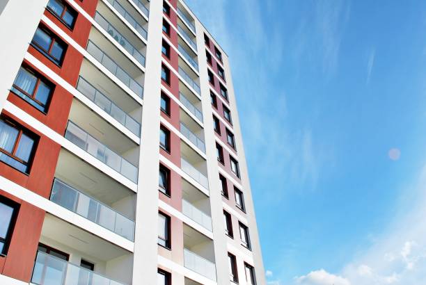 istock Modern, Luxury Apartment Building against blue sky 869375606