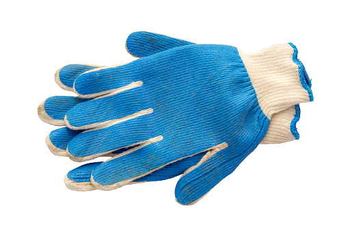 Studio shot of a pair of gardening gloves cut out against a white background