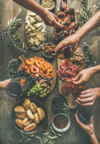 istock Flat-lay of friends hands eating and drinking together 869382852