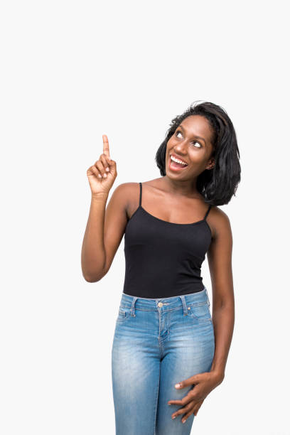 istock Surprised woman pointing up 869386062