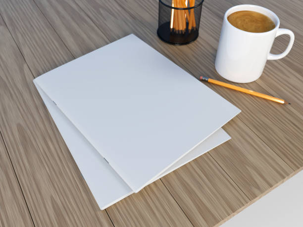istock 3D rendering blank Magazine and mug mock-up on the wooden table 869386286