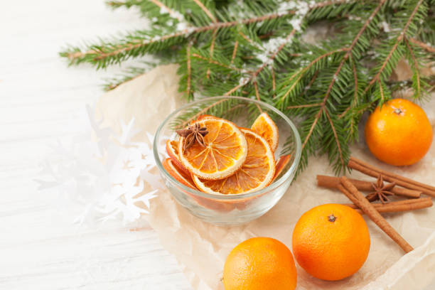 istock Dried oranges, cinnamon, tangerines and fir branch 869386996