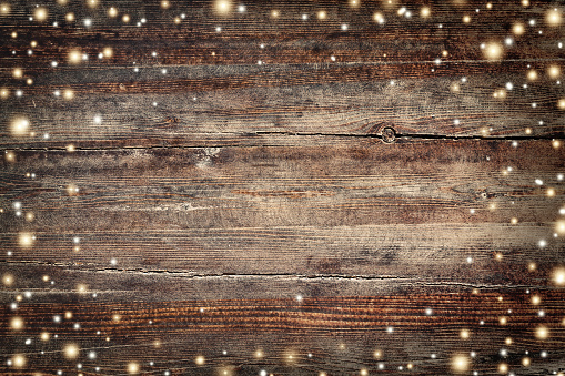 Vintage Christmas background with golden snowflakes and stars
