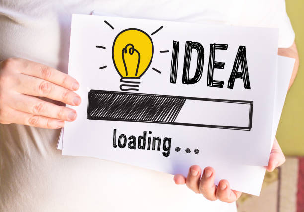 istock man holding Idea Concept On white paper 869390366
