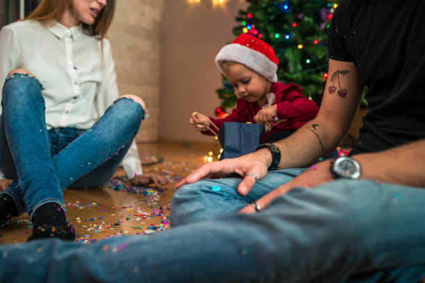istock A little girl opening Christmas gift 869390588