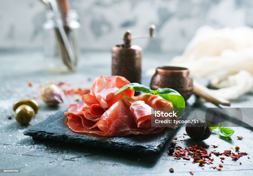 smoked parma ham Smoked Parma ham on the black board Antipasto Stock Photo