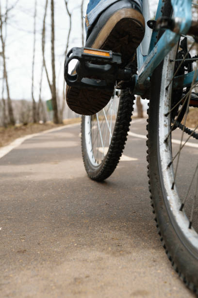 istock Girl on bicycle in Bitsa park, Moscow, Russia 869394614