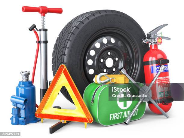 A Set Of Automotive Accessories Spare Wheel Fire Extinguisher First Aid Kit Emergency Warning Triangle Jack Tow Rope Wheel Wrench Pump Stock Photo - Download Image Now