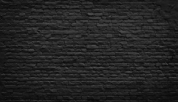 antiguo fondo de pared de ladrillo negro. - piedra material de construcción fotos fotografías e imágenes de stock