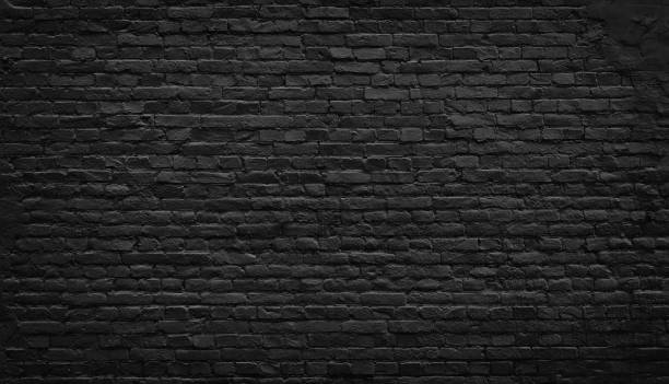 Old black brick wall background. Black brick wall texture, brick surface for background. old stone wall stock pictures, royalty-free photos & images