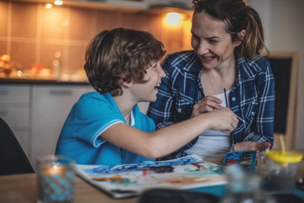 istock Mother and son coloring together. 869405148