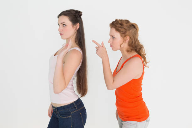 istock Angry young female friends having an argument 869405726