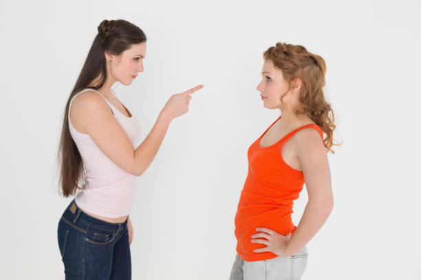 istock Angry young female friends having an argument 869405742