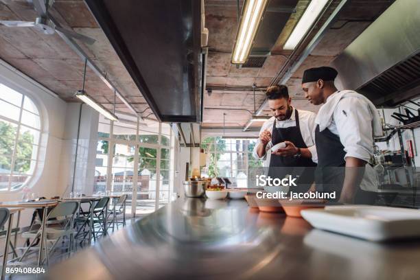 Professional Chefs Working At Restaurant Kitchen Stock Photo - Download Image Now - Commercial Kitchen, Kitchen, Adult