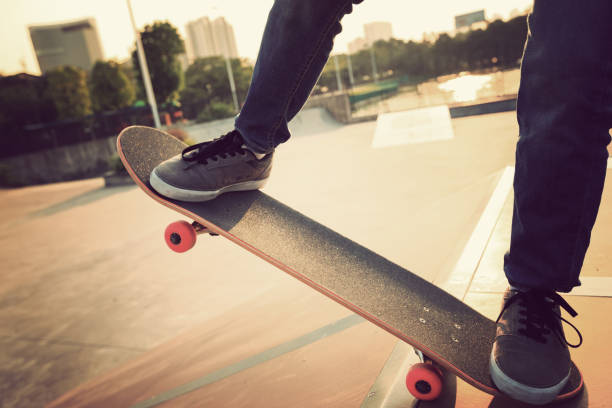 istock skateboarder legs skateboarding on skatepark ramp 869415148