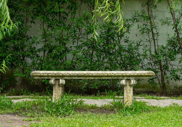 istock Stone bench in outdoor garden 869415520