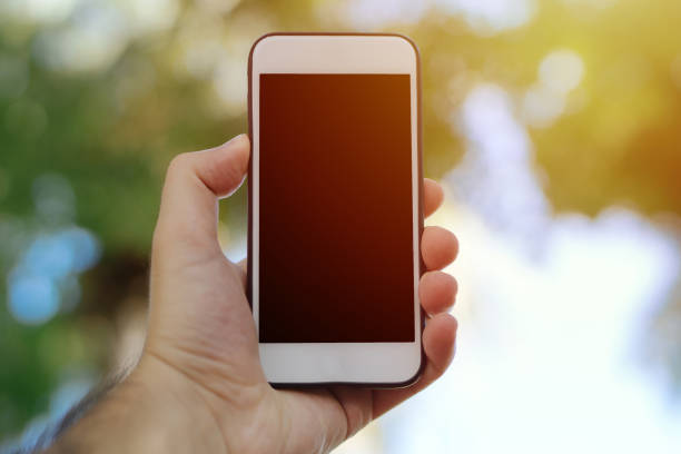 istock Man's hand shows mobile smartphone in vertical position 869423948