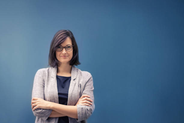 Feeling confident in herself. Fulfilled businesswoman and female leader. Portrait of confident female entrepreneur with arms crossed looking at camera. Copy space."n"n sales executive stock pictures, royalty-free photos & images