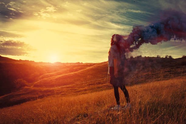 istock Young woman looking at the sunrise 869436892