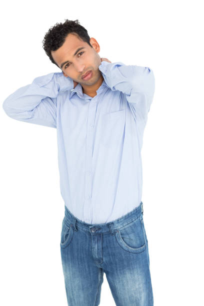 istock Portrait of a young man suffering from neck ache 869437128