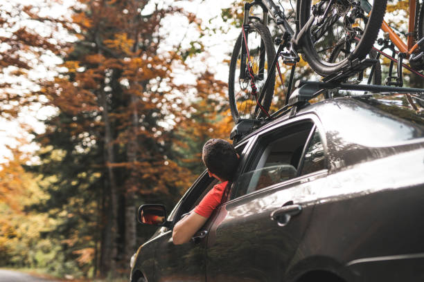 istock Man driving a car on the roadtrip adventure 869437148