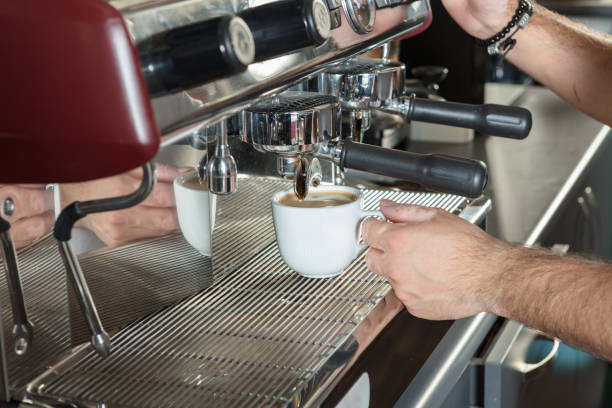 istock Close-up of espresso pouring from coffee machine 869437660