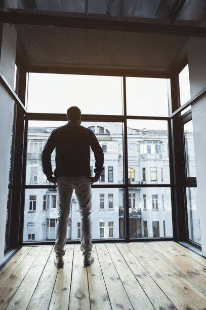 istock Pleasant stylish man is enjoying city landscape 869447650