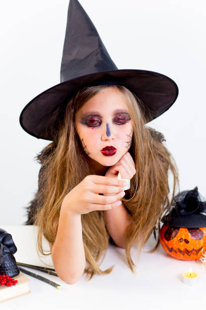 istock Girl in witch costume 869448812