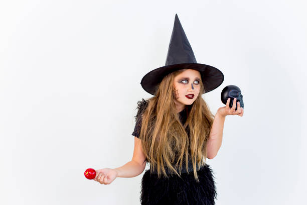 istock Girl in witch costume 869452140
