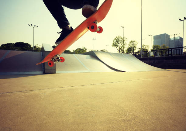 istock skateboarder legs skateboarding on skatepark 869452230