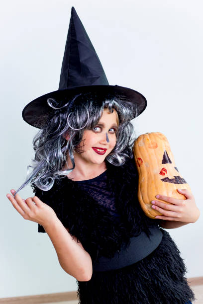 istock Girl in witch costume 869452648