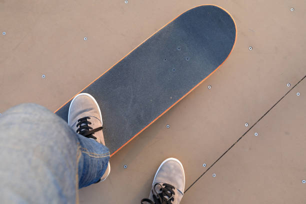 istock skateboarder legs skateboarding on skatepark 869458990