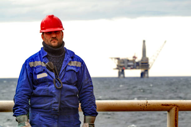 istock Oilman shift workers on the deck of the ship on the background o 869462910