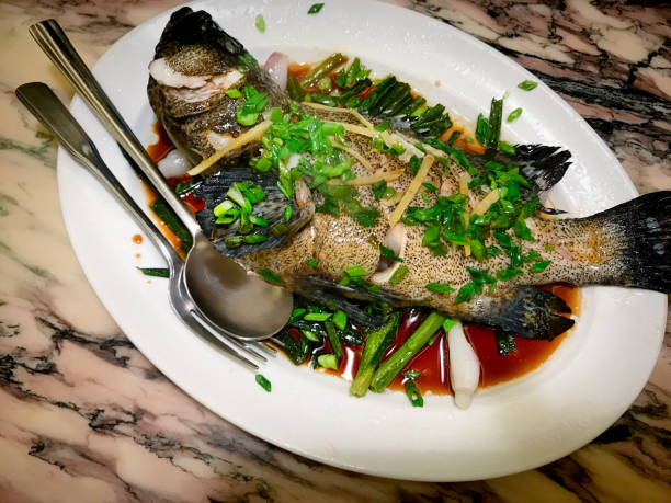 istock Chinese Food - Steamed Fish with Ginger and Scallion 869468836