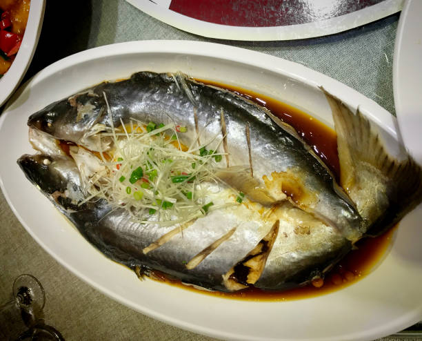 istock Chinese Food - Steamed Fish with Ginger and Scallion 869468944