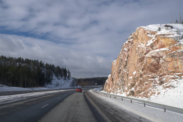 istock Driving on the highway after snow in winter 869469032