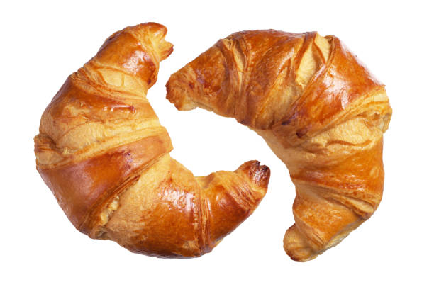 due croissant freschi - croissant foto e immagini stock