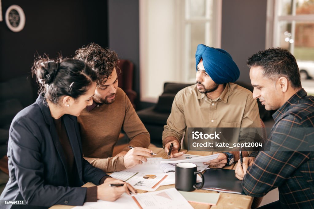 Group of people discussing new strategies Multiracial group indoor Indian Ethnicity Stock Photo