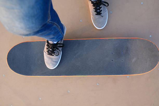 istock skateboarder legs skateboarding on skatepark 869469438