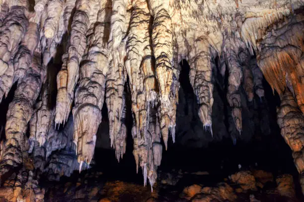 Stalactites and stalagmites slowly growing in the cave.