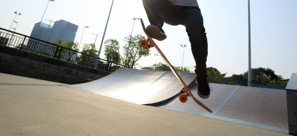 istock skateboarder legs skateboarding on skatepark 869472218